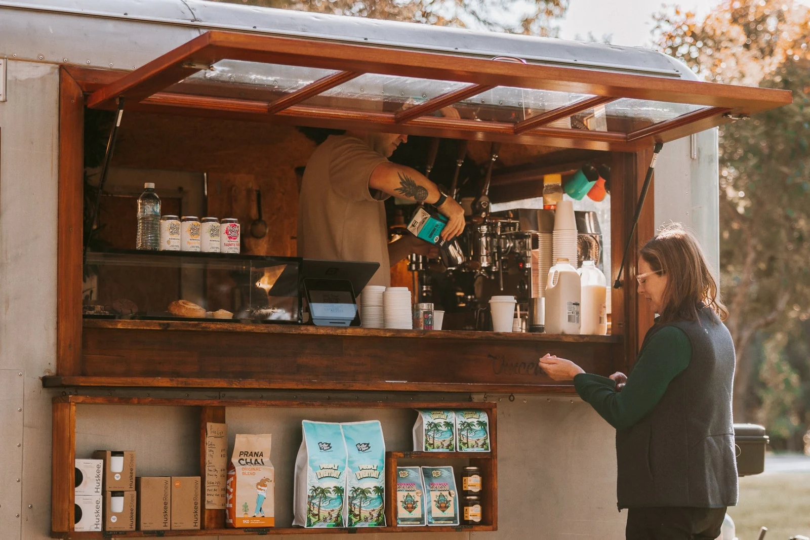 Vincent the Van, a Brother of Mine wholesale partner, preparing coffee for a customer